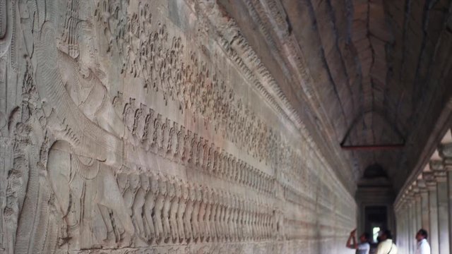The Churning of the Ocean of Milk, the most famous bas-relief scenes at Angkor Wat east gallery. Cambodia