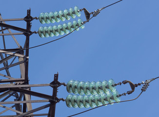 Power line pylon with high-voltage insulator - obrazy, fototapety, plakaty