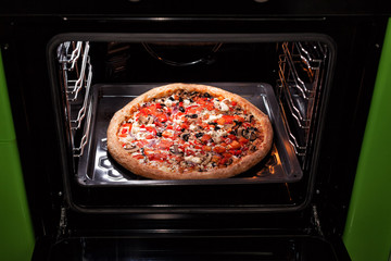 Pizza baking in the oven
