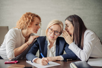 Two female employees with miserable faces asking their blond female boss to arrange a party for the...