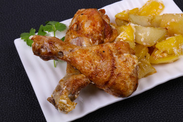 Roasted chicken legs with potato