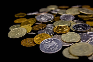 Coins stack on black background in concept wall and strong money.