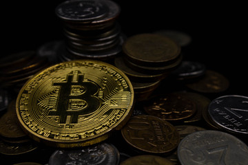 Golden Bitcoin on a black background, money