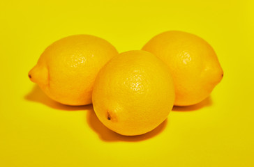 Lemon on yellow background. Сopy space . Food concept.