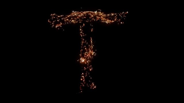 Letter T burning. Steel wool smoldering. Beautiful combustion.