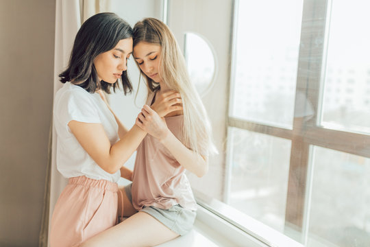 Tiny Lesbian Girls Having Sex - two lesbians making love indoors. close up photo. copy space. sexual  behavior concept. females going to have sex. woman holding a shoulder of  other one Stock Photo | Adobe Stock