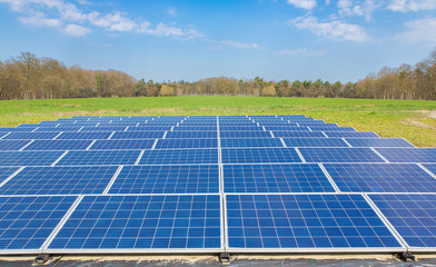 Dutch landscape with blue solar panels field