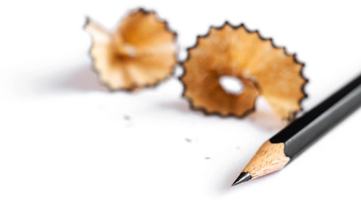 A pencil and a piece of a pencil on white paper background. Copy space for your text or image.