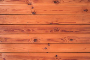 bright background of lacquered yellow pine boards