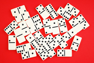 Dominoes on red background.