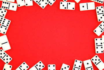 Dominoes on red background.