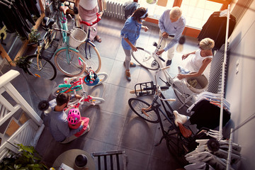 Family buying new bicycle in bike top view.
