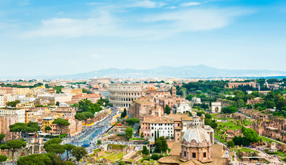 Fototapeta na wymiar Scenic aerial view. Panorama. Colosseum and Roman Forum in sunny spring day. Rome. Italy