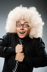Young man wearing afro wig