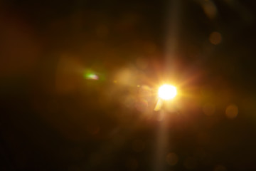 Abstract Natural Sun flare on the black background.