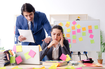 Two colleagues employees working in the office 