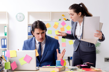 Two colleagues employees working in the office 