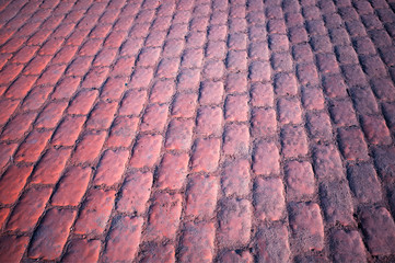 Diagonal reddish stone pavement texture background hd