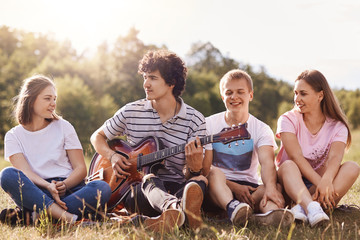 Friends enjoying singing songs, spending time together, have good mood, celebratng someone's...