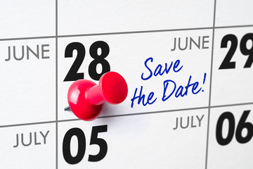 Wall calendar with a red pin - June 28