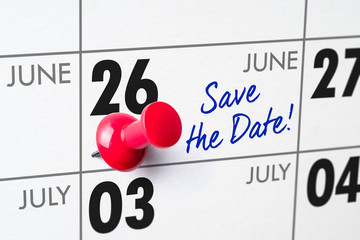 Wall calendar with a red pin - June 26