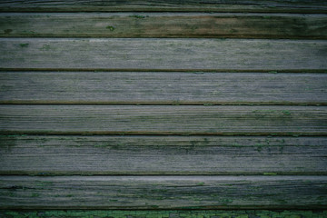 Obraz premium Green wooden texture as background old collapsing fence