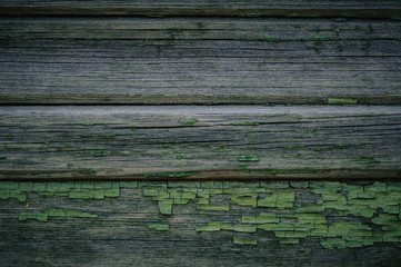 Green wooden texture as background old collapsing fence