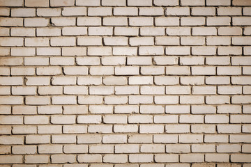 Background of old vintage dirty brick wall with peeling plaster, texture