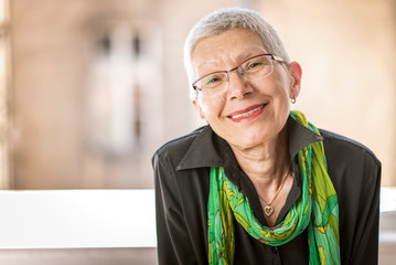 Portrait of beautiful senior business woman with white, grey hair