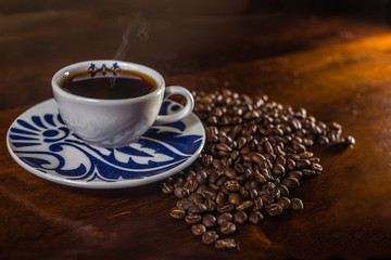 Coffee beans and a cup of coffee.