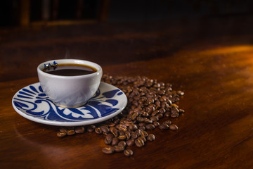 Coffee beans and a cup of coffee.