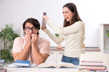 Students preparing for exam together at home 