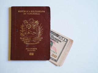 Old passport Venezuela and dollars on a white background.