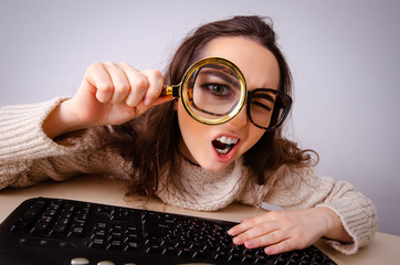 Funny nerd girl working on computer