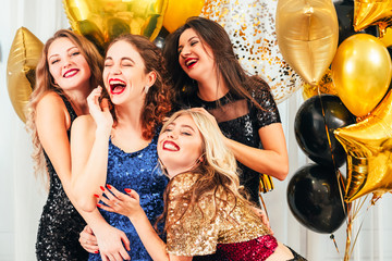 Fancy cocktail party. Girls enjoying entertainment, laughing, having fun, looking amused in hall...
