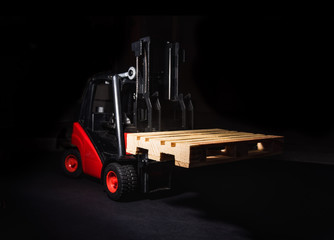 The forklift and wooden pallet
