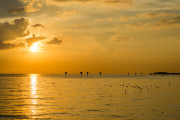 Landscape of sea during the morning sunrise or evening sunset period with light reflection on water.