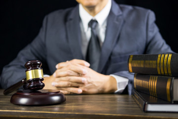 justice and law concept.Male judge in a courtroom working on wood table with documents., attorney court judge justice gavel legal legislation concept.