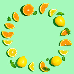 Round frame of oranges and lemons overhead view flat lay