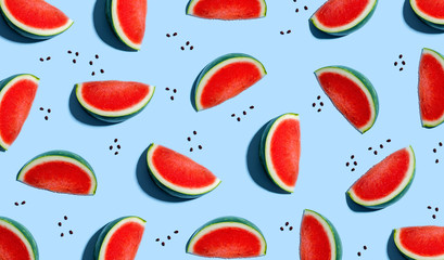 Sliced watermelons arranged on a blue background