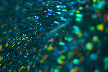 Defocused emerald texture. Green bokeh sparkles. Lens flare effect.