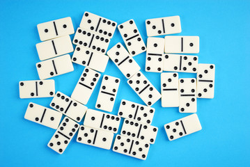dominoes on blue background.