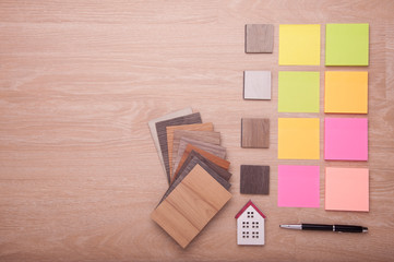 Home materials design for Interior. wood texture floor. Samples of laminate and vinyl floor tile on oak wooden Background for new construction or renovate building