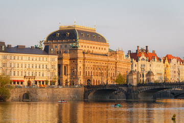 National Theater building in Prague, Czech Republic with Vltava River at sunset