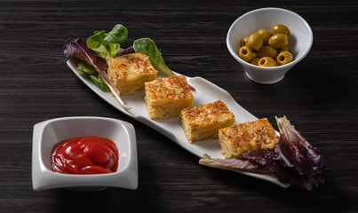 spanish omelette and olives on restaurant