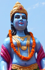 Closeup view of Hindu God Rama against blue sky