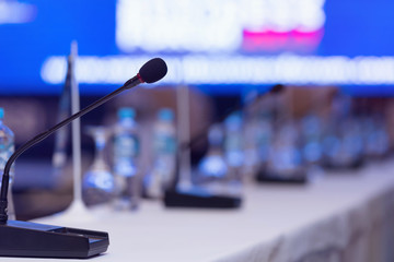 Front view of the microphones during business conference in conference room or hall, panel...