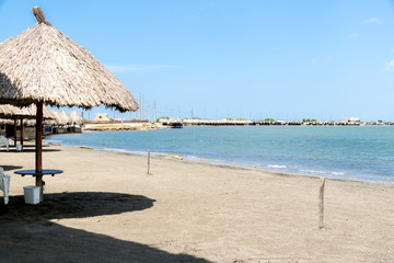 beach with chairs and umbrellas