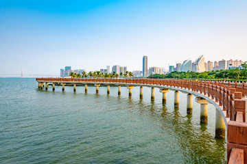 Fototapeta na wymiar Bridges and buildings in Golden Bay, Zhanjiang city