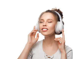 attractive girl with headphones on white background
